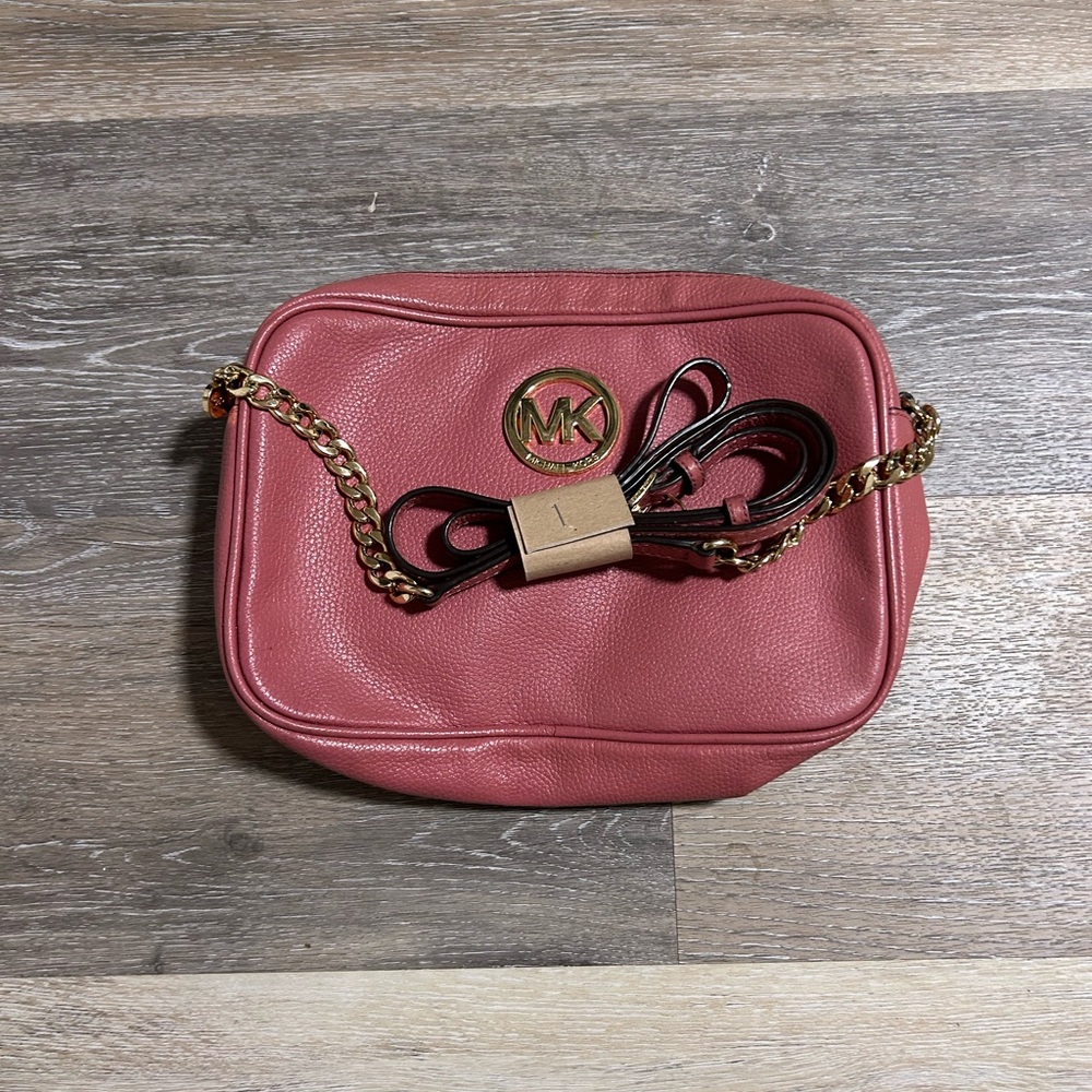Pink with gold accents 
Michael Kors Crossbody